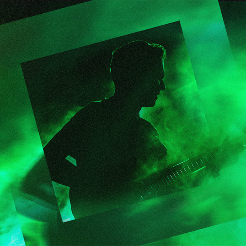 Guitarist with green lighting and smoke with square OVO branding