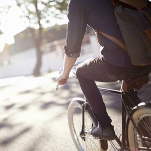 Man cycling in the sunshine.