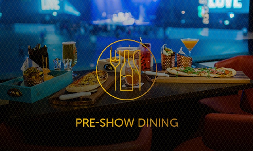 Food and drinks on a table overlooking the stage and standing section of the OVO Hydro with Pre-Show Dining text and icon overlay. 