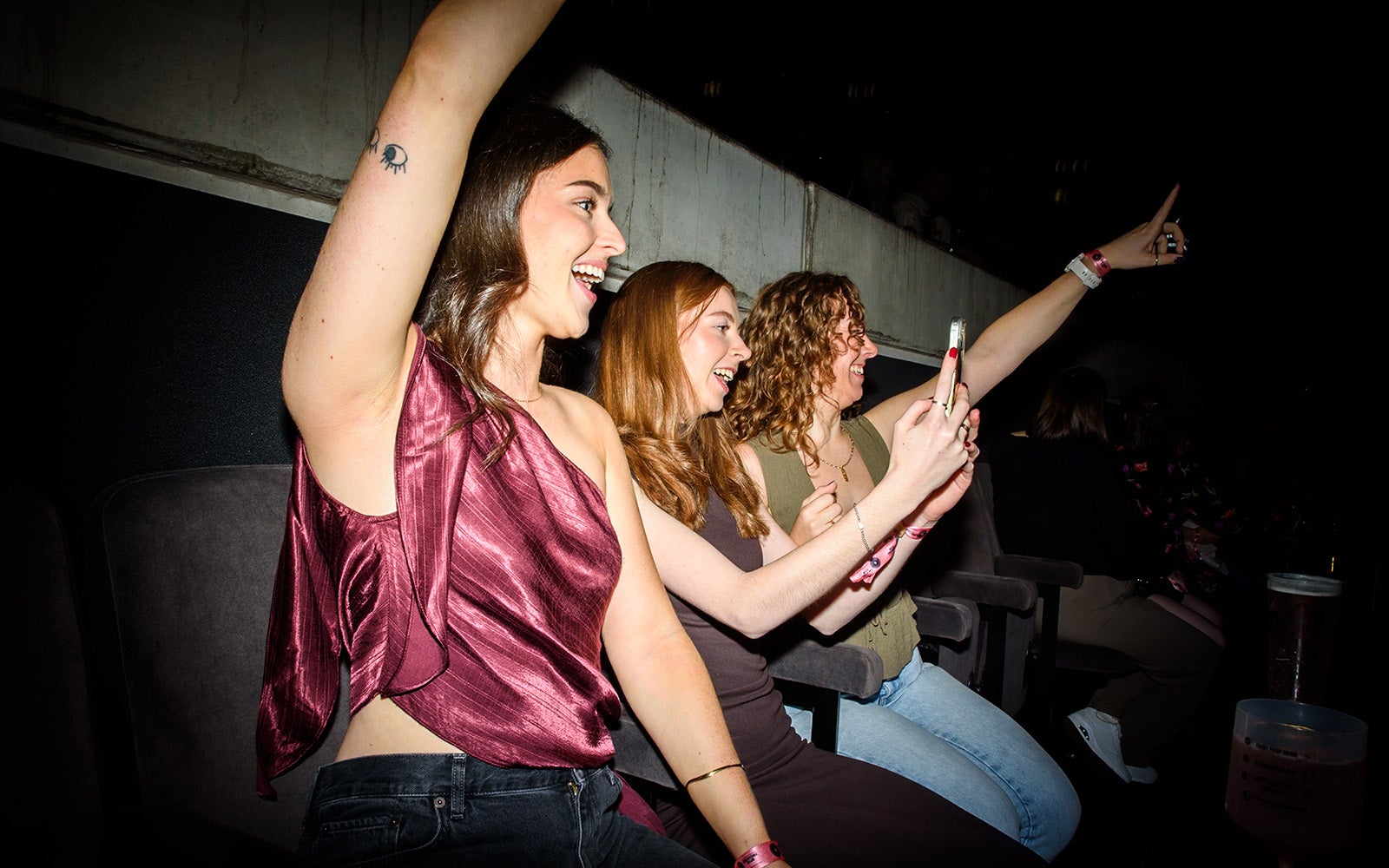 Three women dancing in The Terrace at a gig.