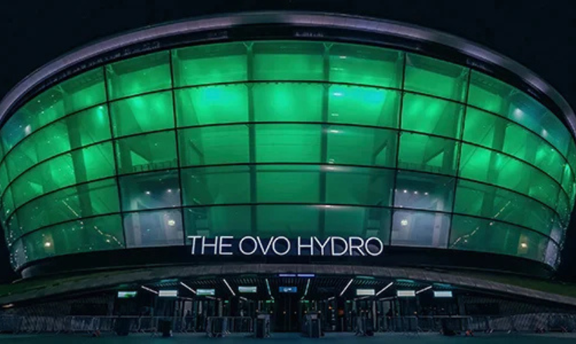 The front of the OVO Hydro at night lit up green